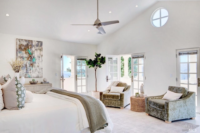 bedroom featuring high vaulted ceiling, french doors, multiple windows, and access to exterior