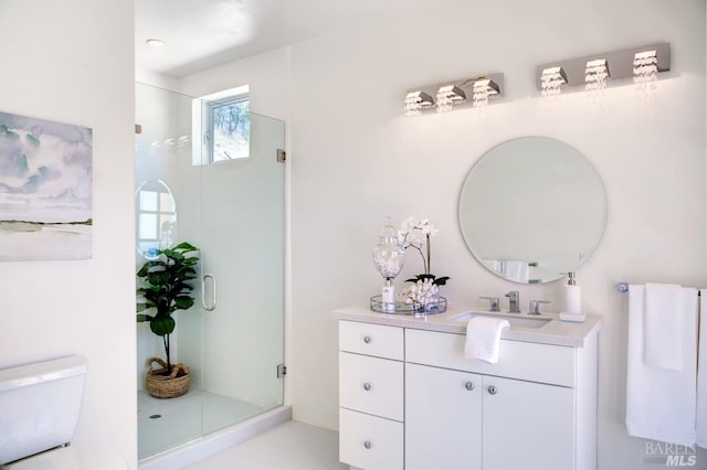 full bathroom featuring toilet, a shower stall, and vanity