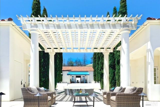 view of patio featuring outdoor lounge area and a pergola