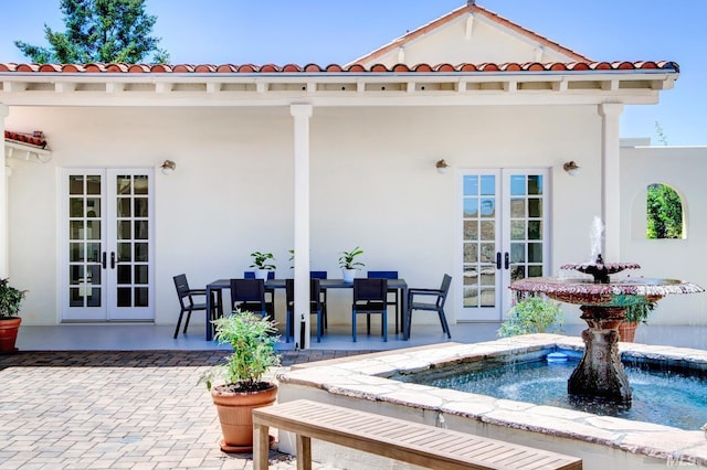 view of patio with french doors and outdoor dining area