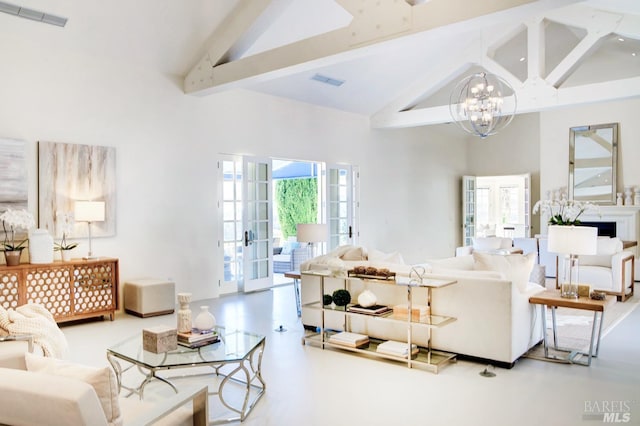 living room with high vaulted ceiling, visible vents, and a notable chandelier