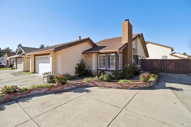 single story home featuring a garage