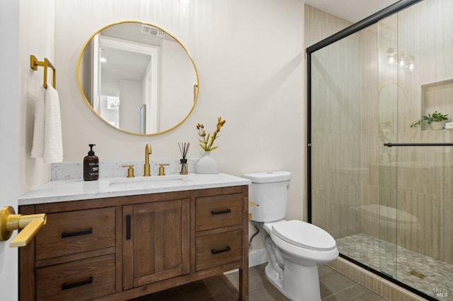 bathroom with vanity, an enclosed shower, tile patterned floors, and toilet