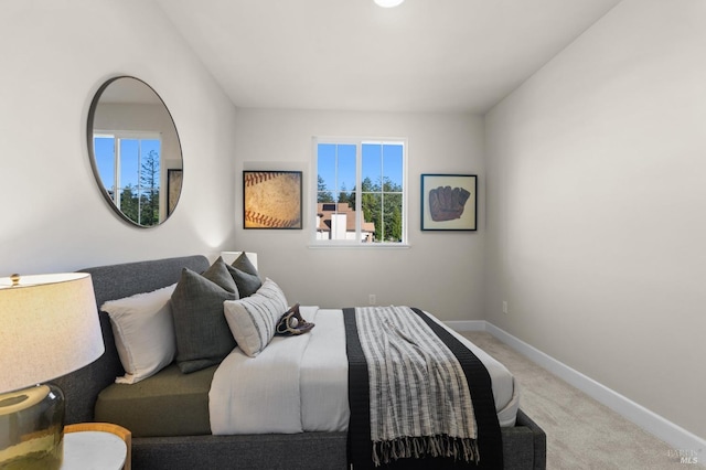 bedroom featuring light carpet