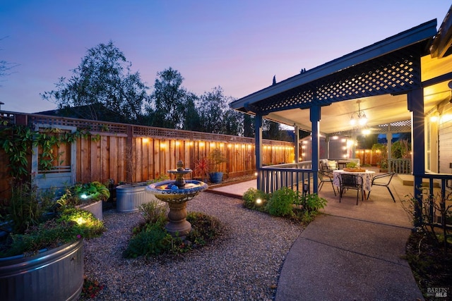 view of patio terrace at dusk