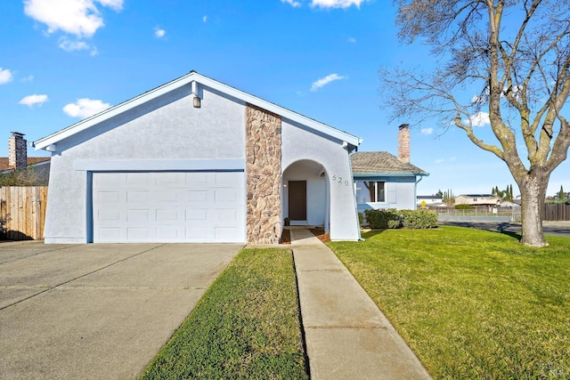 view of front facade with a garage and a front lawn