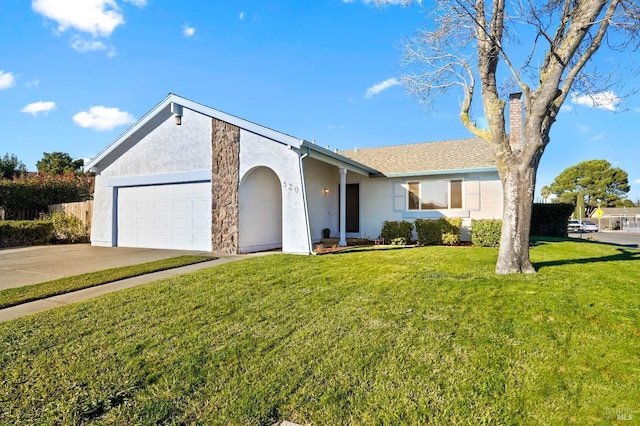 ranch-style house featuring a front lawn and a garage