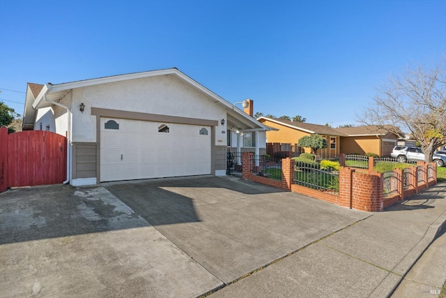 single story home featuring a garage