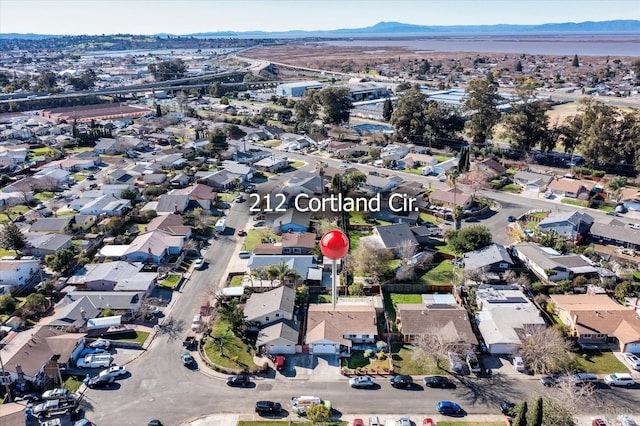 birds eye view of property featuring a mountain view