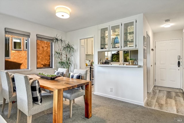 dining space featuring light wood-type flooring