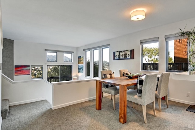 view of carpeted dining space