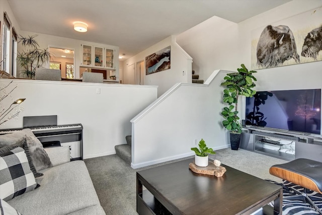 living room featuring dark colored carpet