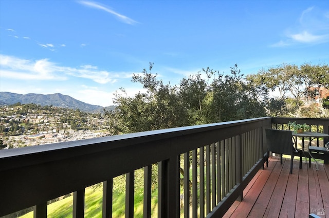 wooden terrace with a mountain view