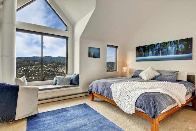 bedroom with a mountain view, a baseboard radiator, high vaulted ceiling, and carpet flooring