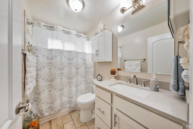 full bathroom with vanity, toilet, and shower / tub combo with curtain