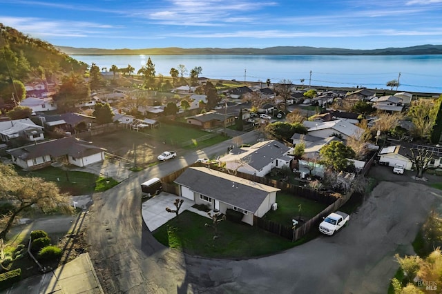 birds eye view of property featuring a water and mountain view