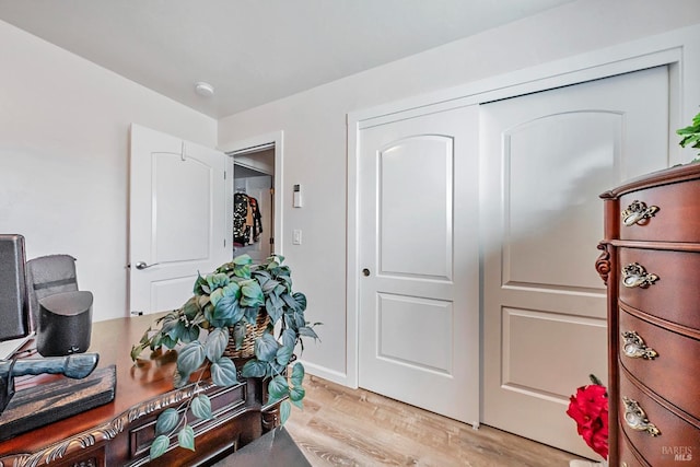 office with light hardwood / wood-style floors