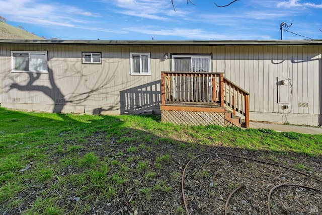 rear view of property with a deck