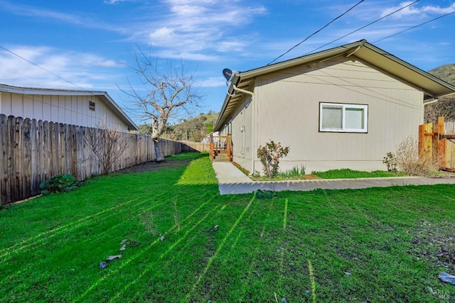 view of property exterior with a lawn