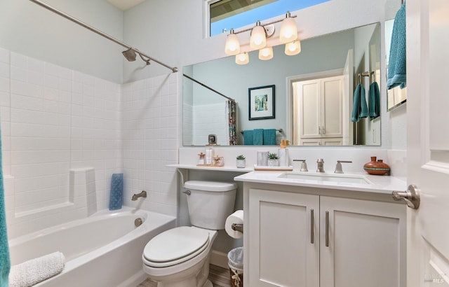 full bathroom with shower / tub combo, vanity, and toilet