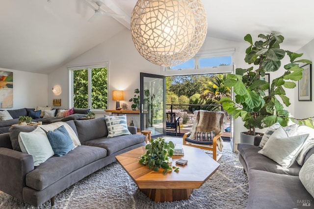 living room with vaulted ceiling with beams