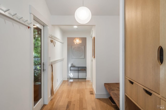 corridor featuring light hardwood / wood-style floors