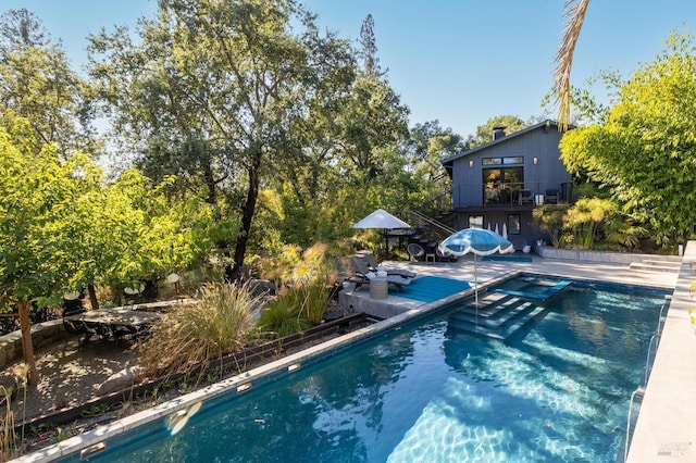 view of pool featuring a patio