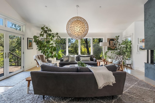 living room featuring french doors and vaulted ceiling