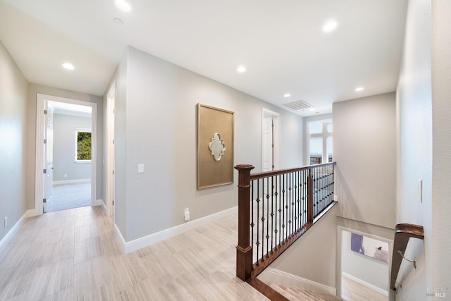 hallway with light wood-type flooring