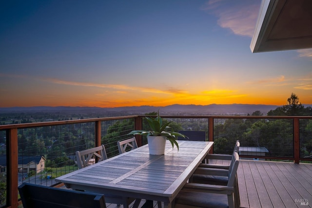 deck at dusk with a mountain view