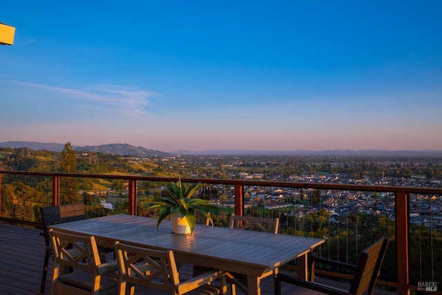 deck at dusk with a mountain view