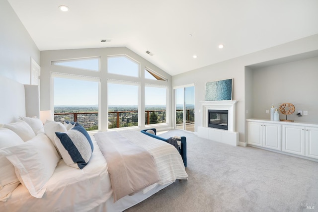 bedroom featuring carpet, a fireplace, and vaulted ceiling