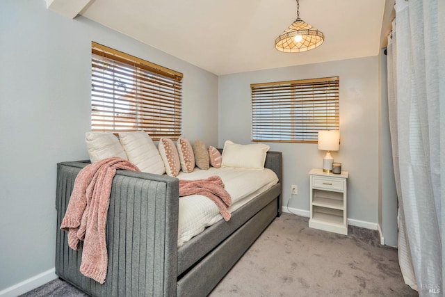 bedroom featuring light carpet