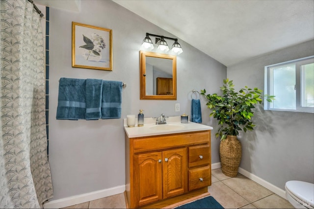 bathroom featuring walk in shower, vanity, tile patterned flooring, toilet, and lofted ceiling