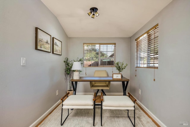 office space with hardwood / wood-style flooring and lofted ceiling