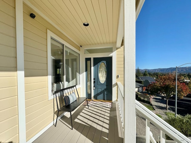 view of exterior entry with a mountain view