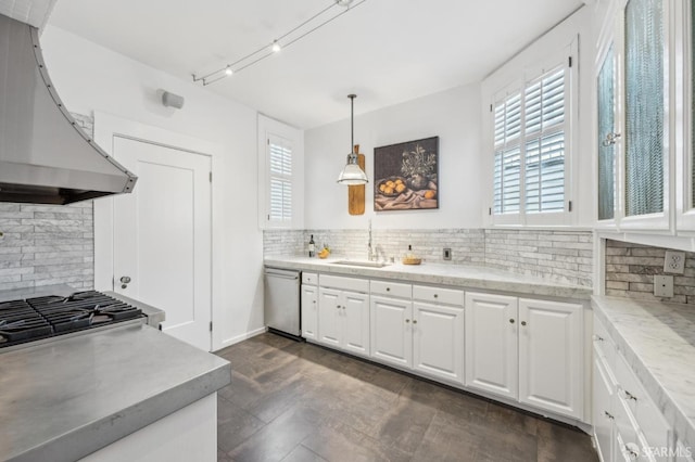 kitchen with dishwasher, hanging light fixtures, white cabinets, extractor fan, and tasteful backsplash