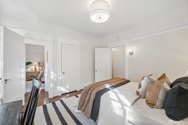 bedroom featuring dark wood-type flooring