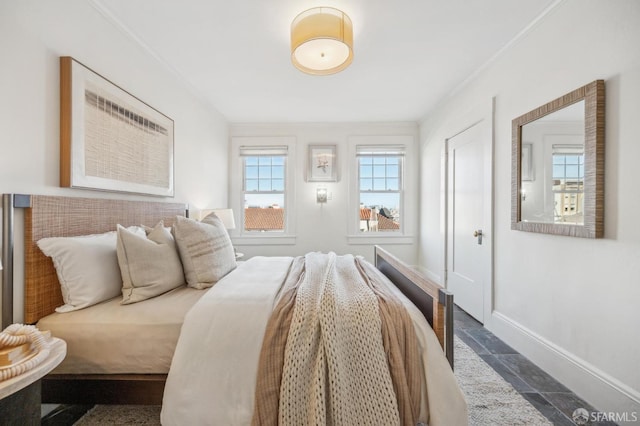 bedroom with ornamental molding