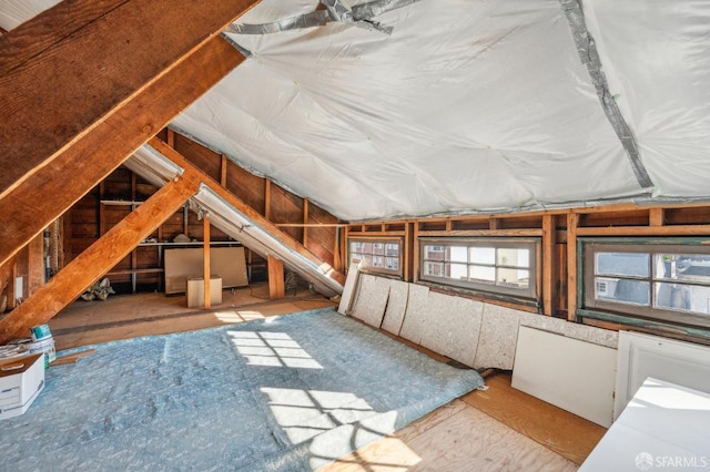 attic featuring a wealth of natural light