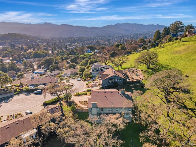 birds eye view of property with a mountain view