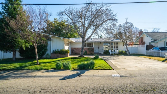 ranch-style house with a front lawn