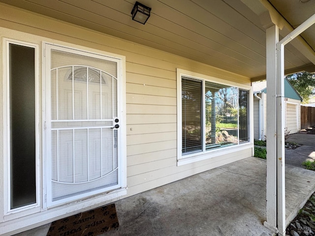 doorway to property with a patio