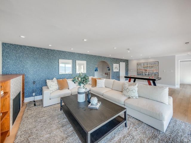 living room with light hardwood / wood-style flooring