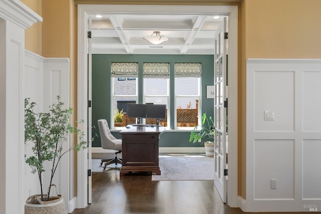 office area with coffered ceiling, dark wood-type flooring, and beamed ceiling