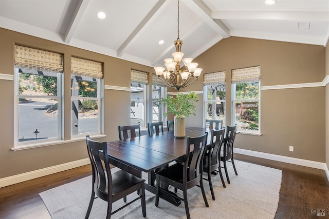 dining space featuring dark hardwood / wood-style floors, a wealth of natural light, a chandelier, and vaulted ceiling with beams