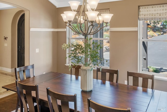 dining space featuring a notable chandelier