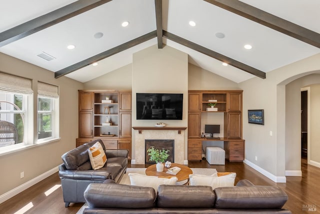 living room with a premium fireplace, high vaulted ceiling, dark wood-type flooring, and beam ceiling