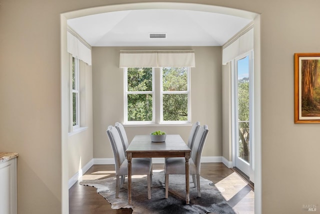 dining space featuring wood-type flooring