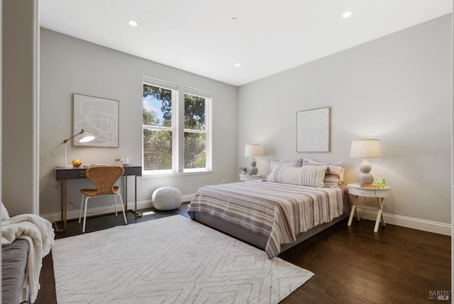 bedroom featuring dark hardwood / wood-style flooring